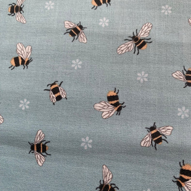 Expertly designed by Lewis and Irene, this Bee Fabric features adorable chubby bees in a soft pale blue or cream colour palette. Made with high-quality quilters cotton, this fabric is perfect for creating charming and whimsical projects. Add a touch of nature and sweetness to your sewing projects with this delightful fabric, fabric by the meter, bee fabric, buy fabric with bees on, bee designs,